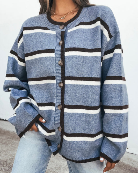 Striped Sweater - Denim Blue oversized button-down cardigan featuring blue, white, and dark brown stripes.