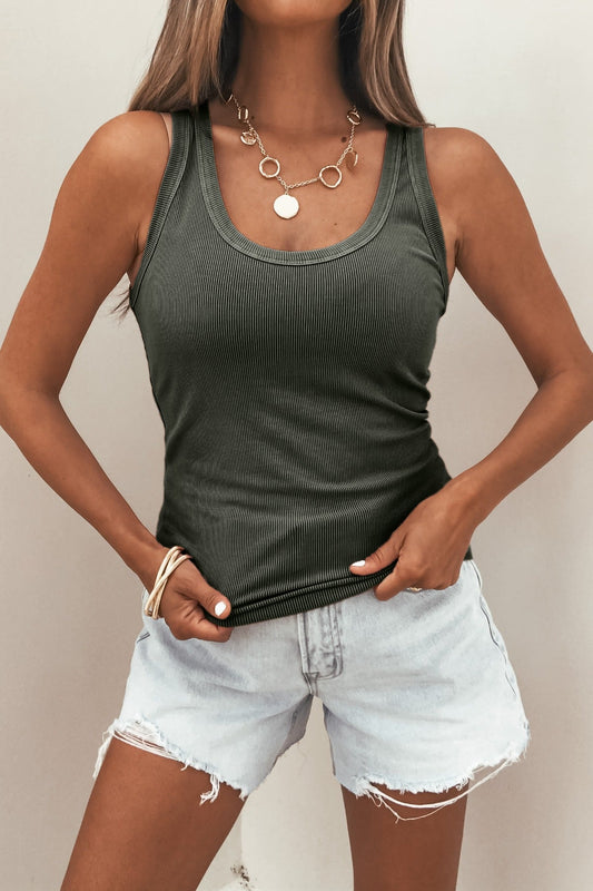 Woman wears a Charcoal Ribbed Scoop Neck Tank Top with light denim shorts, gold necklace, and bracelets against a plain background.