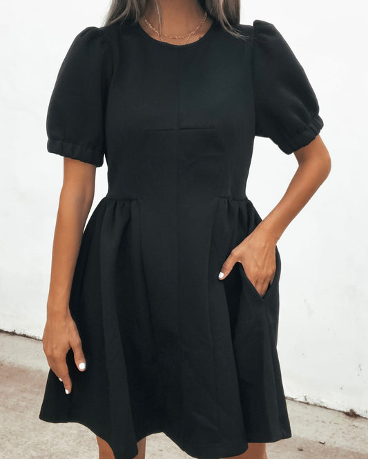 Puff Sleeve Mini Dress - Black featuring a crew neckline and a pocket.