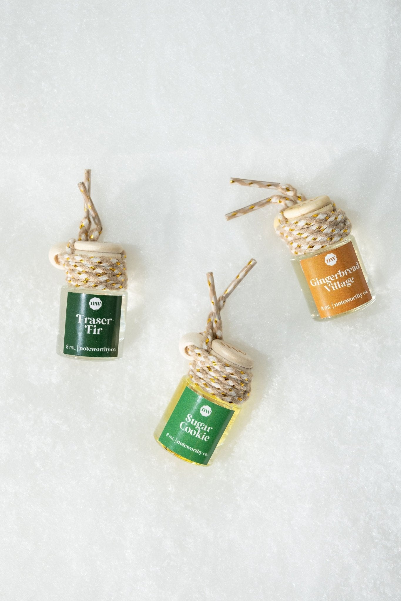 The Fraser Fir Car Diffuser features a braided hanging cord—perfect as a Christmas gift for festive holiday scents on the go.