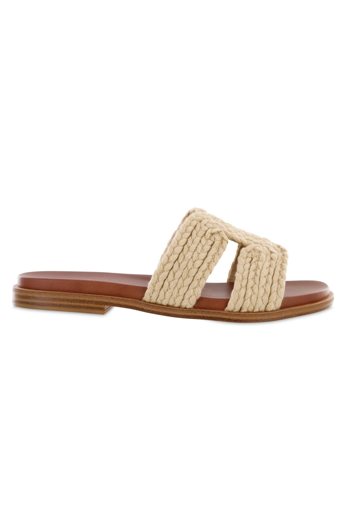Side view of MIA Poet Natural Woven Slide Sandals with a tan sole and wide, woven beige strap across the top.