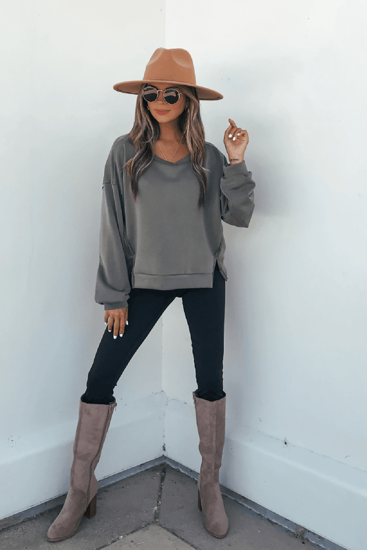 Woman wears an Olive Soft Cloud Scuba Top, an everyday essential in lightweight scuba fabric, with a tan hat and sunglasses.