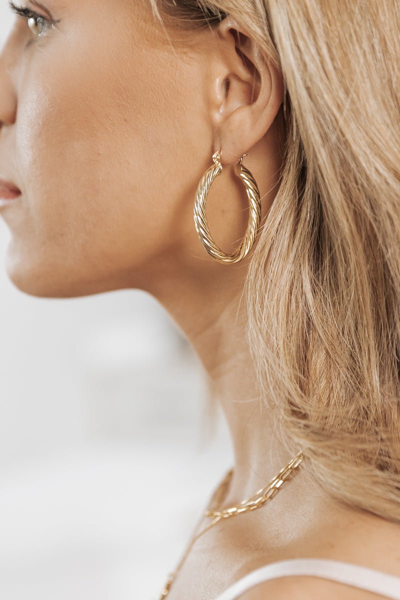 Gold Twisted Metallic Oval Hoop Earrings