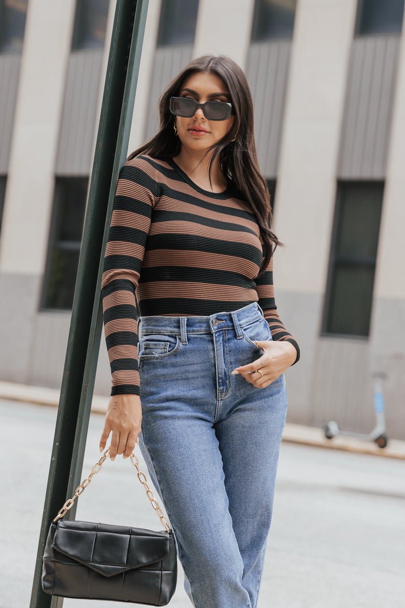 http://magnoliaboutique.com/cdn/shop/products/muse-by-magnolia-long-sleeve-striped-rib-knit-top-229537.jpg?v=1695234547