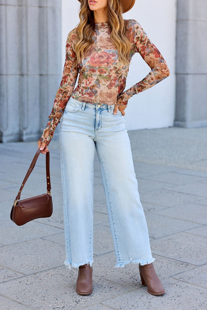 Woman in the Elevated Floral Mesh Top - Cream, wide-leg jeans, brown ankle boots, hat, and matching brown purse.