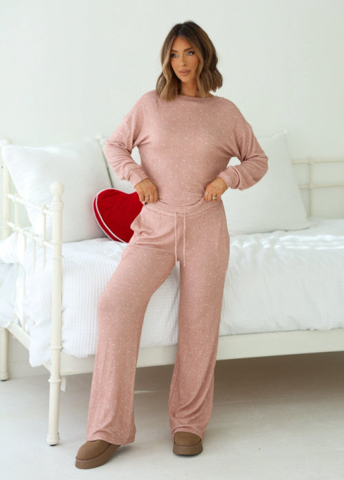 Hayley A is standing indoors wearing our Buttery_Soft_Blush_Polka_Dot_Lounge_Top_Pants