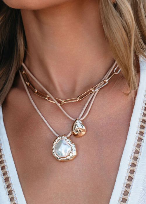 New Jewelry Home Page image. Cat is wearing our Coastal Lux 3 Layered Necklace.