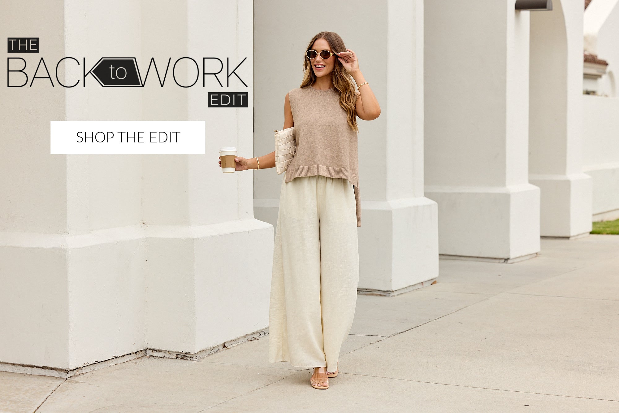 A woman stands outdoors in front of white architectural columns, wearing a sleeveless beige knit top and wide-leg cream pants. Text overlays on the left read 'THE BACK to WORK EDIT' and 'SHOP THE EDIT'.