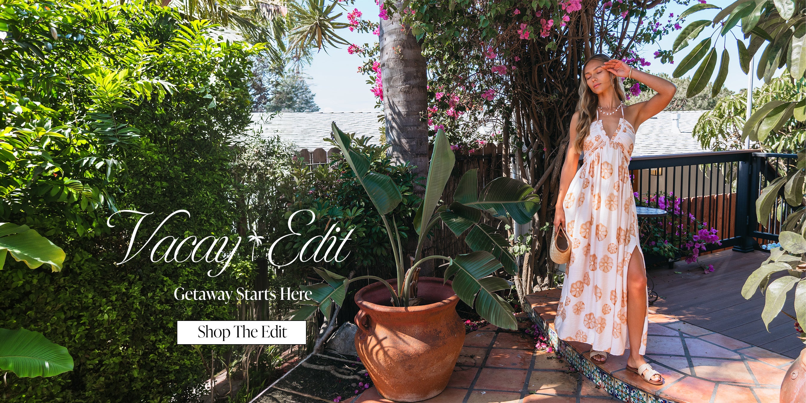 Woman in a dress standing in a garden with text overlay 'Vacay Edit' and 'Shop the Edit'.
