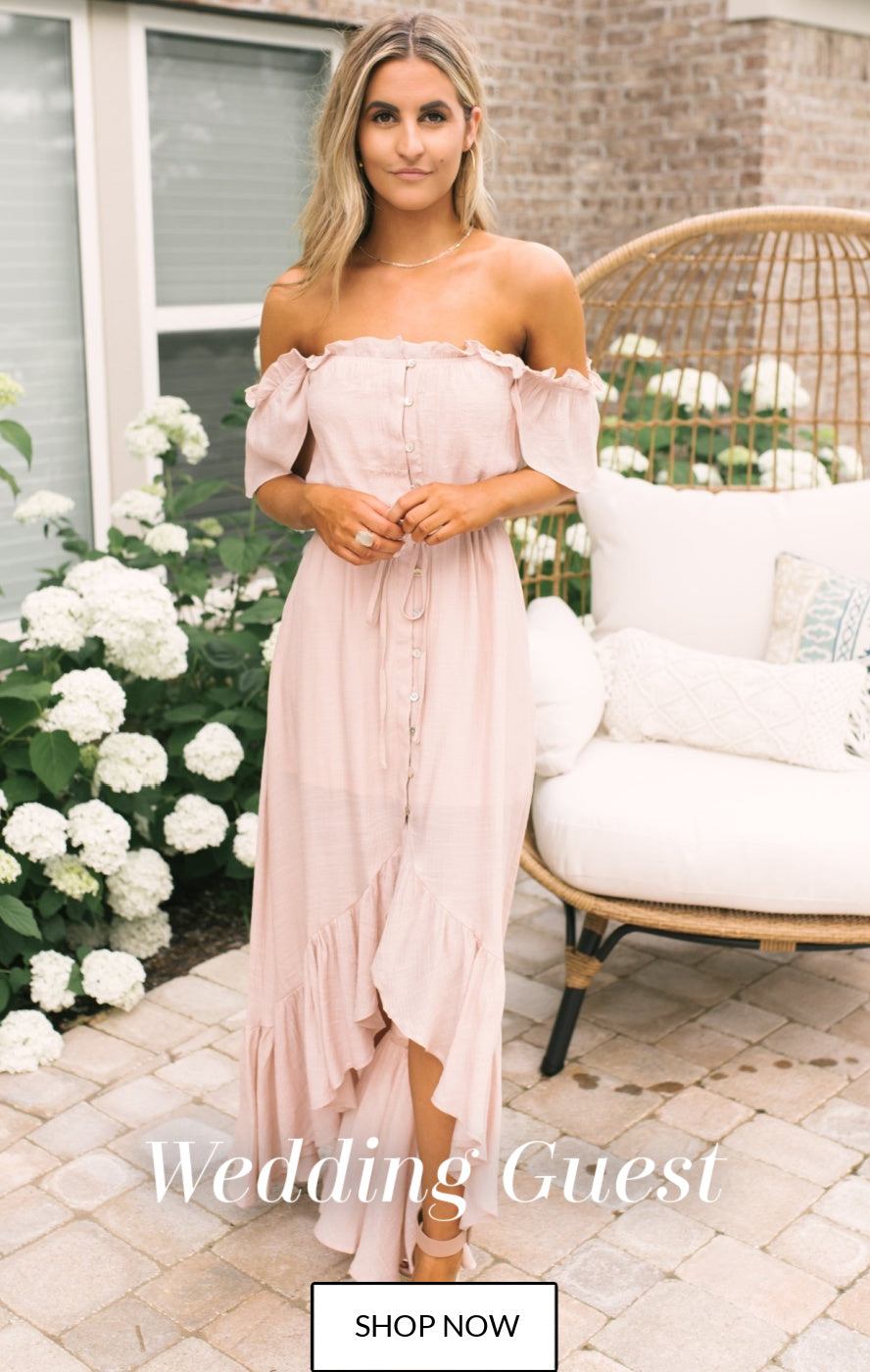 Wedding Guest Dresses - home page graphic. Mykal is wearing our Blush High Low Maxi Dress.