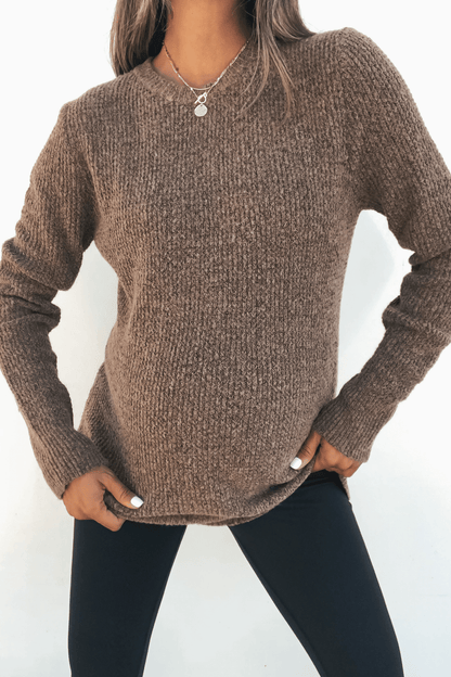 Model wearing the Autumn Glow Brushed Ochre Waffle Knit Sweater with black pants, posing against a plain white background.