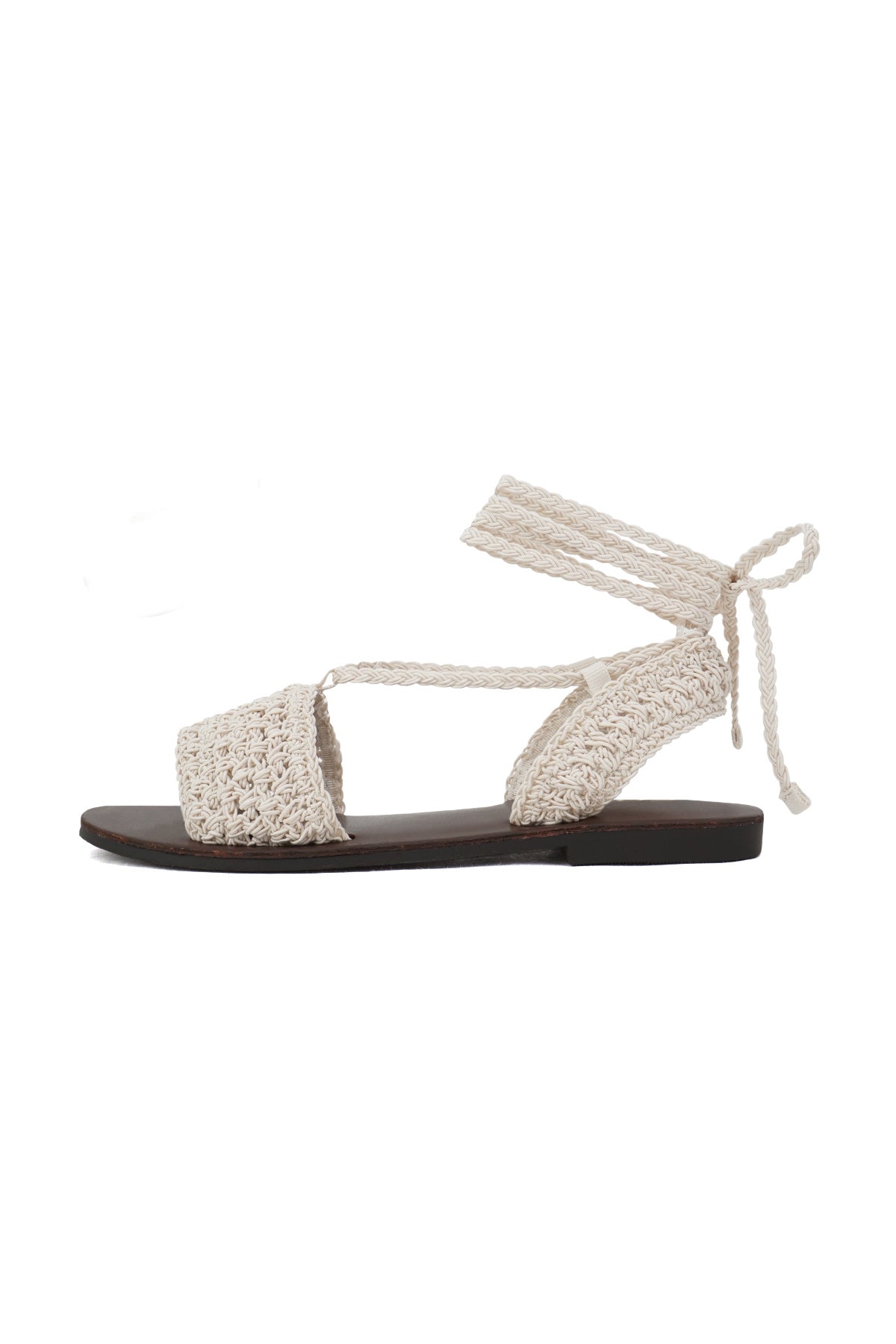 Bone Crochet Ankle Tie Flat Sandals with a dark brown sole, shown in profile on a white background.