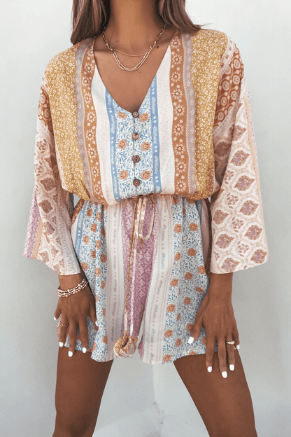 Callie's Painted Days Multi Print Romper—elastic waist, vibrant hues—makes a standout addition to your summer wardrobe.