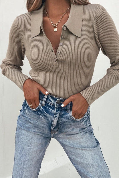 Woman wearing a Coffee Ribbed V-Neck Button Up Top with blue high-waisted jeans and layered gold necklaces—perfect for daily style.