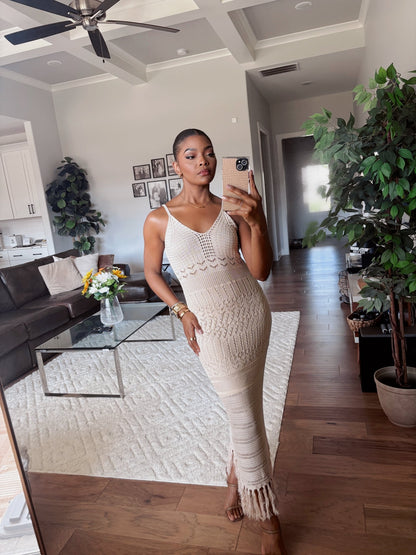 Woman in a Cream Crochet Detail Midi Dress takes a mirror selfie in a stylish, plant-filled boho living room.
