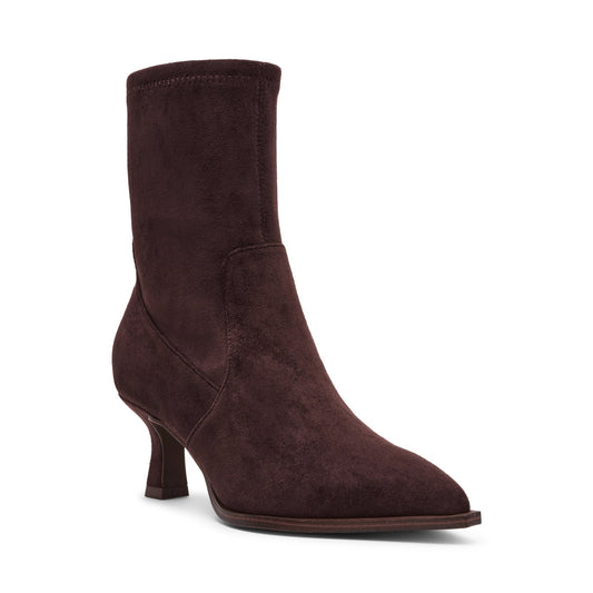 The Dolce Vita Lalana Brown Heeled Suede Booties feature a mid-height heel and pointed toe, shown angled on a white background.