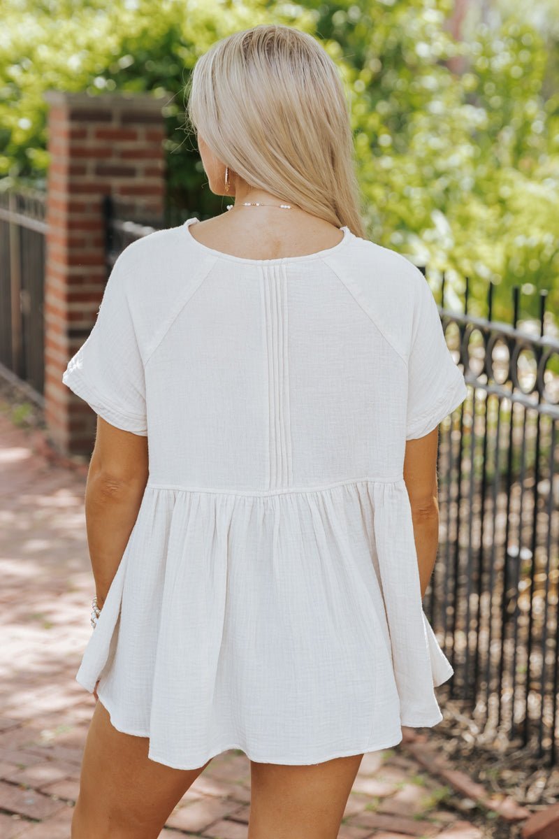 cream flowy tops