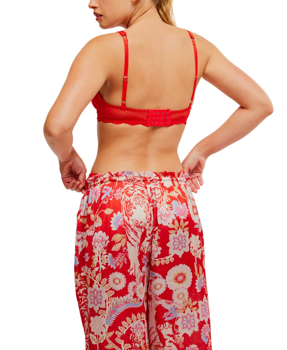 Woman wearing the Free People Red Mid Week Underwire Bra, shown from the back against a white background.