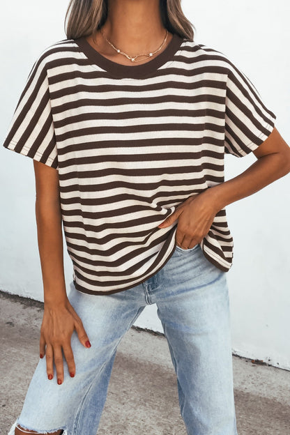 Model wears the Joan Striped Knit Top - Brown with light blue ripped jeans against a white background.