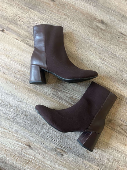 MIA Bronwen Brown Heeled Ankle Booties with textured fabric and leather accents, displayed on a wooden floor.