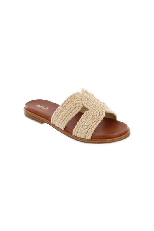 The MIA Poet Natural Woven Slide Sandals feature a flat brown base, a tan top strap, and MIA branding on the cushioned footbed.