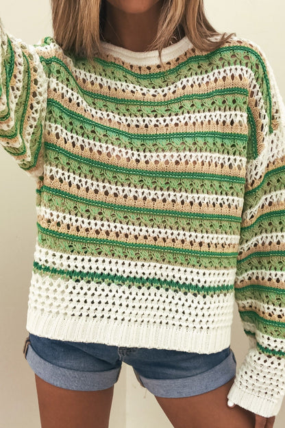 Wearing a Multi Green Striped Boatneck Sweater and blue denim shorts for a cozy, casual look.