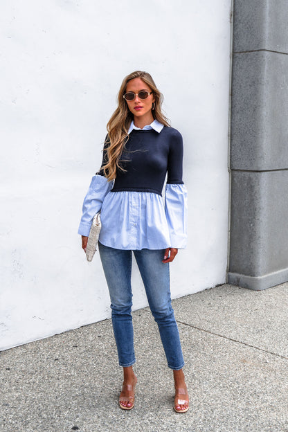 Woman in sunglasses, Steve Madden Lenny Top - Navy, jeans, clear heels, with a textured white clutch against a white wall.