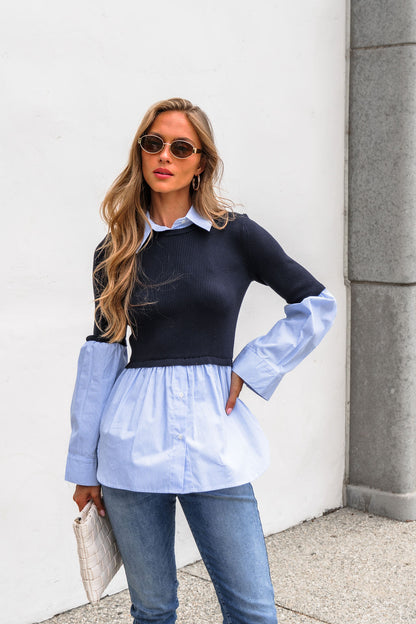 Woman in sunglasses wears the Steve Madden Lenny Top - Navy, blue jeans, and a white clutch, standing against a white wall.