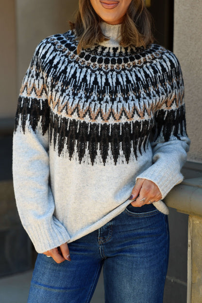 Woman wearing an Oatmeal Fair Isle Mock Neck Sweater with blue jeans.