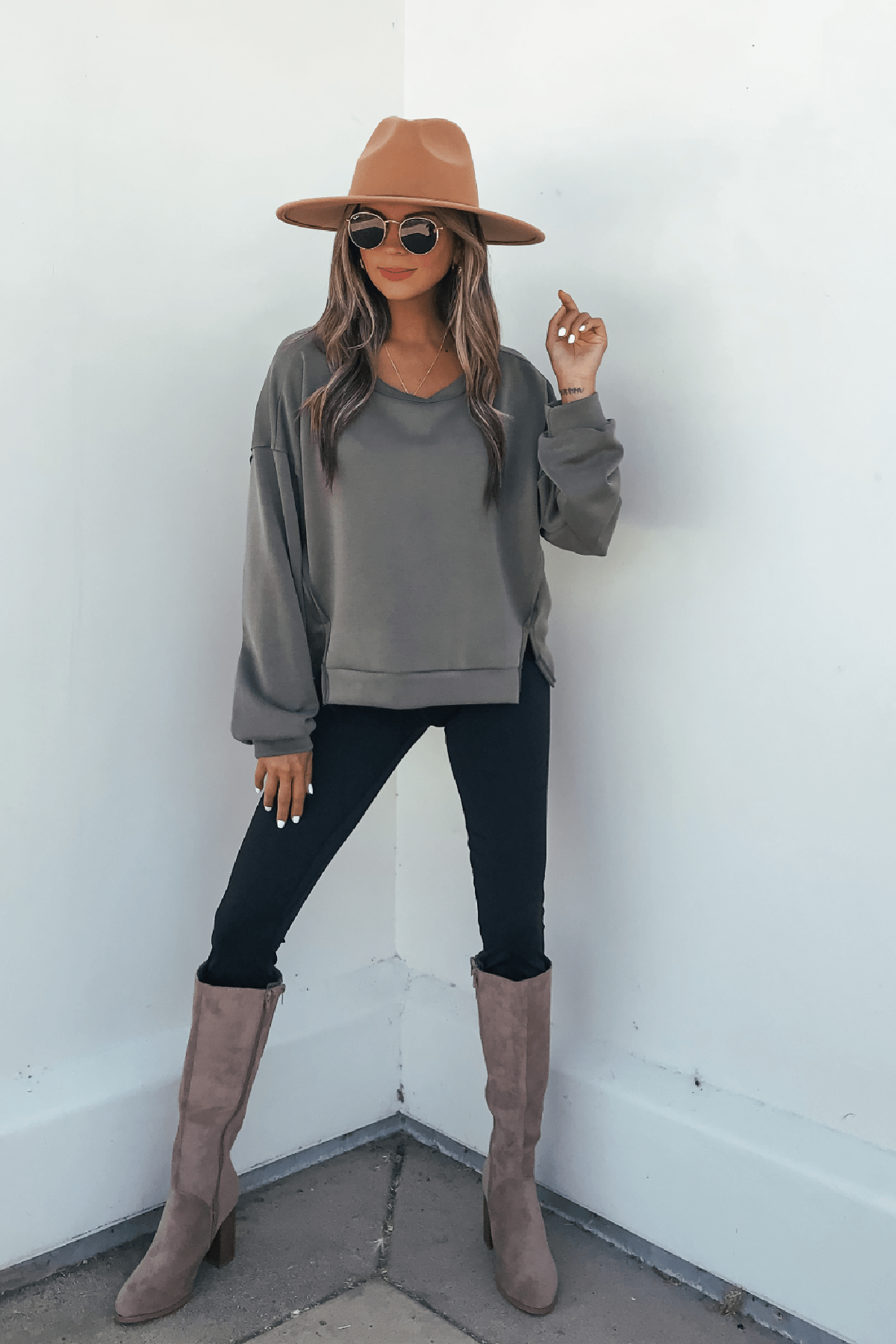 Woman wears an Olive Soft Cloud Scuba Top, an everyday essential in lightweight scuba fabric, with a tan hat and sunglasses.