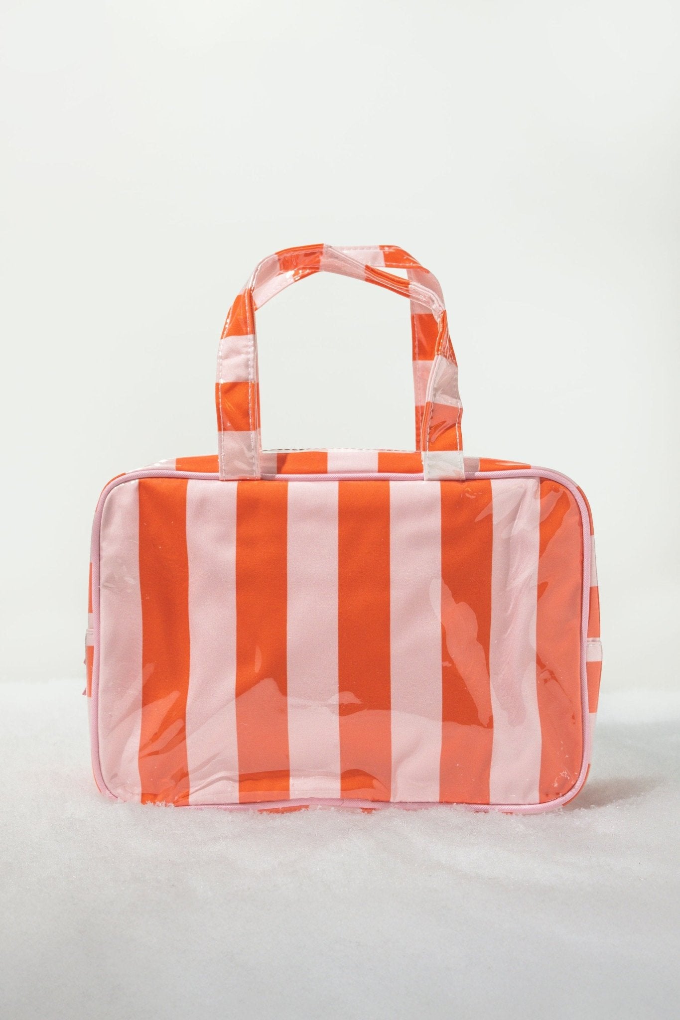 Red and pink striped travel cosmetic bag with handles; stylish, waterproof, and perfect as a tote or makeup organizer.