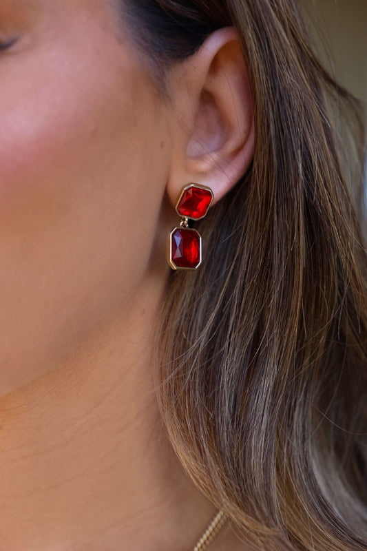 Red Double Gemstone Dangle Earrings with gold accents and two large rectangular red stones shown in close-up.