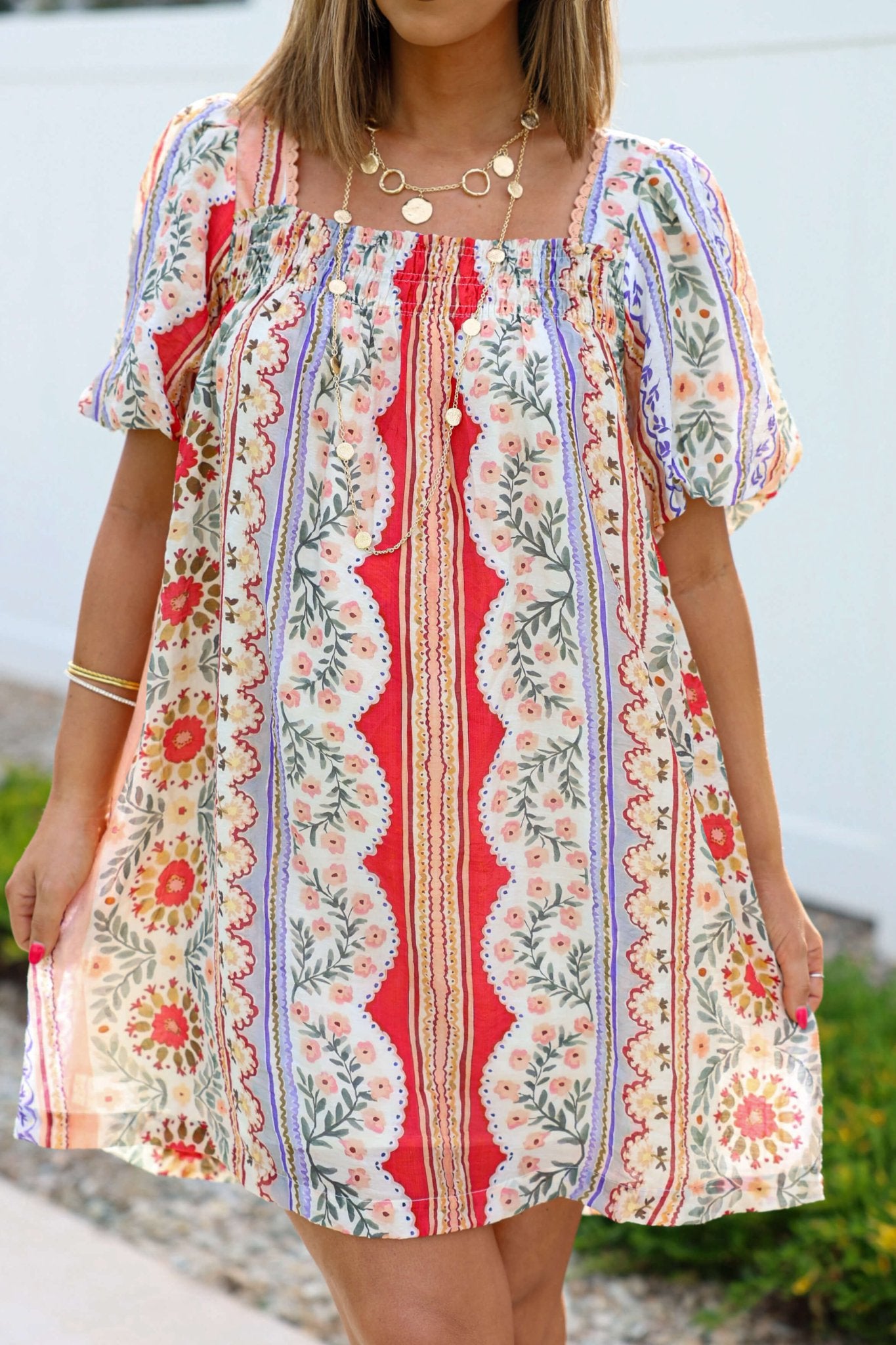 Woman in Red Mix Print Puff Sleeve Mini Dress - FINAL SALE, with a square neckline and red, purple, and cream floral prints.