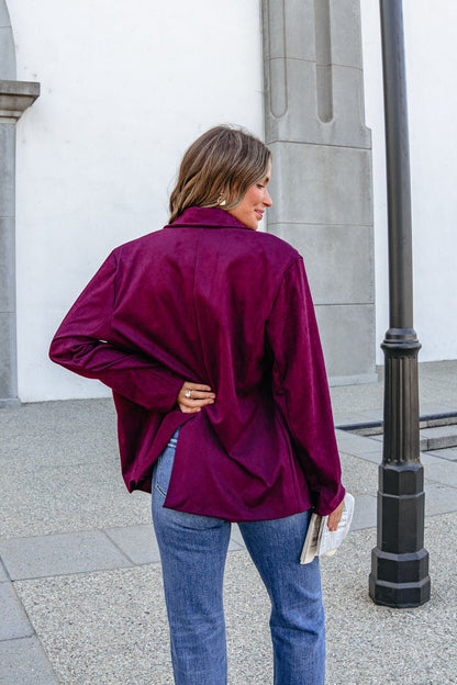 Woman in a wine suede SHE AND SKY ST1741 oversized blazer jacket stands outdoors, back turned, holding a book.