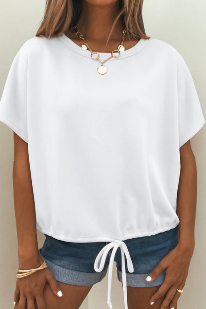Woman wears the Soft Cloud Scuba Lounge Top - White with denim shorts, gold jewelry, and neutral nail polish.