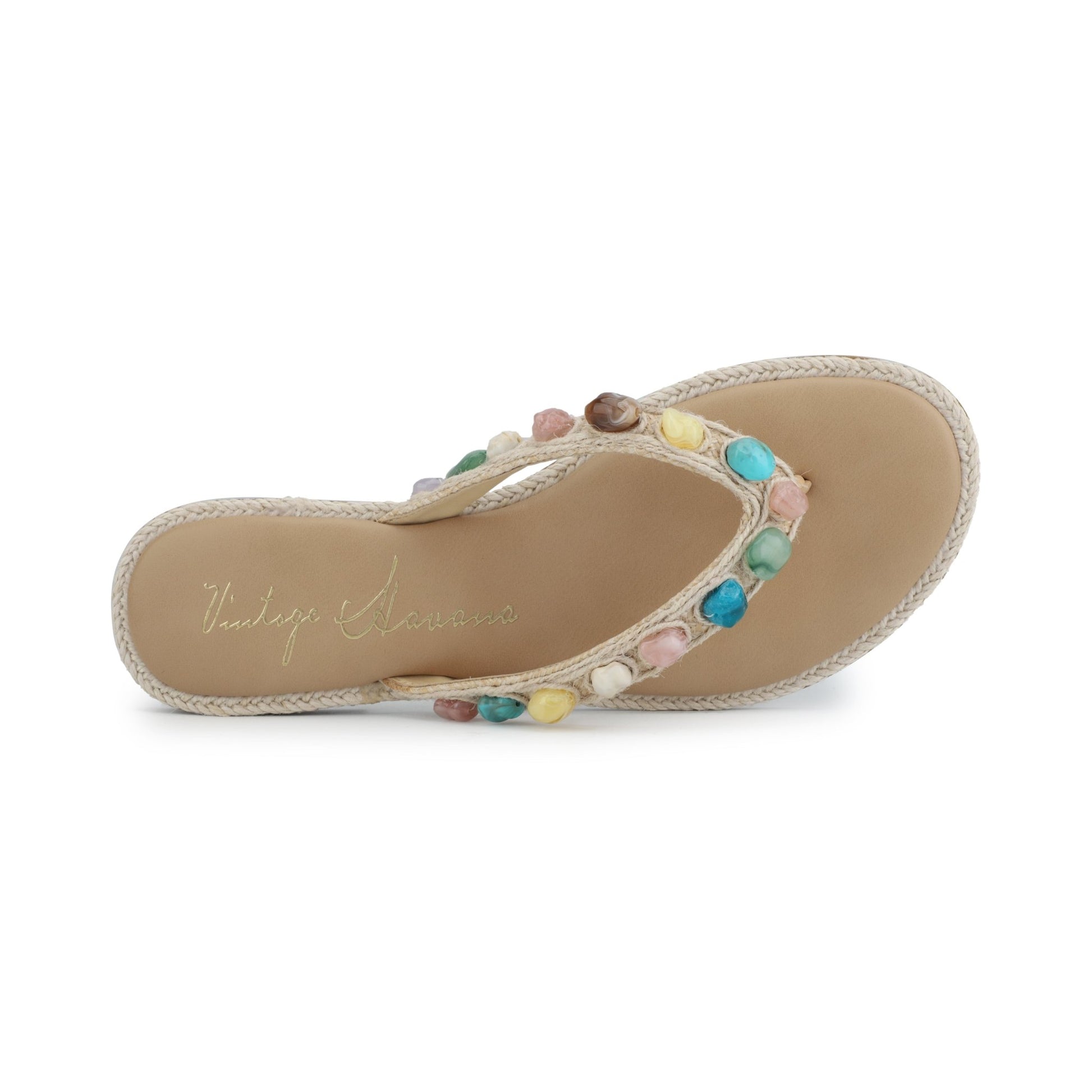 The Vintage Havana Sandy Beige Gemstone Flip Flops feature colorful stones on the straps and Vintage Havana branding on the insole.