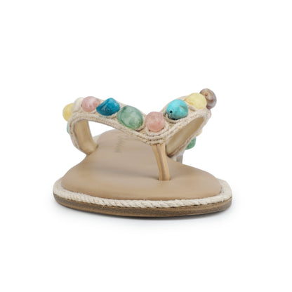 Front view of Vintage Havana Sandy Beige Gemstone Flip Flops with a leather sole and colorful beads on the strap, on white background.