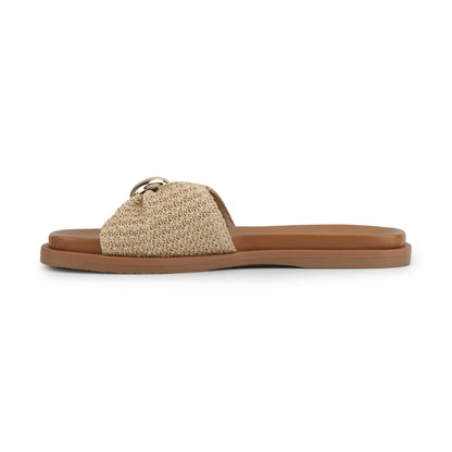 The Vintage Havana Yvette Beige Slide Sandals feature a tan woven strap and gold buckle, shown in side profile on white.