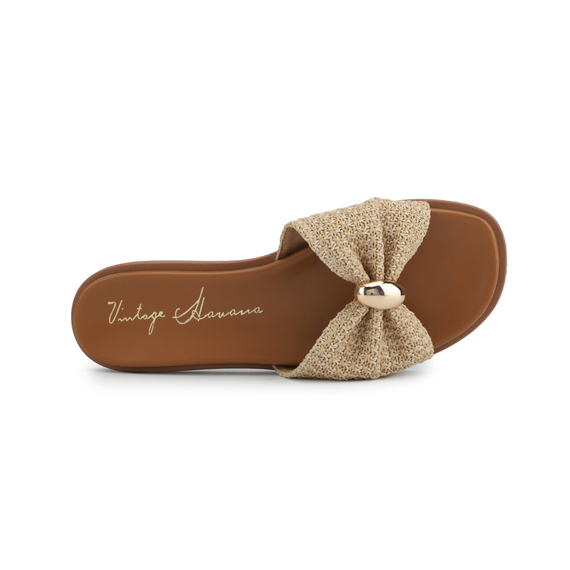 Vintage Havana Yvette Beige Slide Sandals feature a textured bow, gold accent strap, and labeled insole for chic comfort.