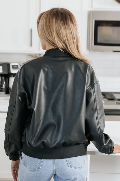https://magnoliaboutique.com/cdn/shop/products/black-faux-leather-zip-up-bomber-jacket-903737.jpg?v=1700899969&width=416
