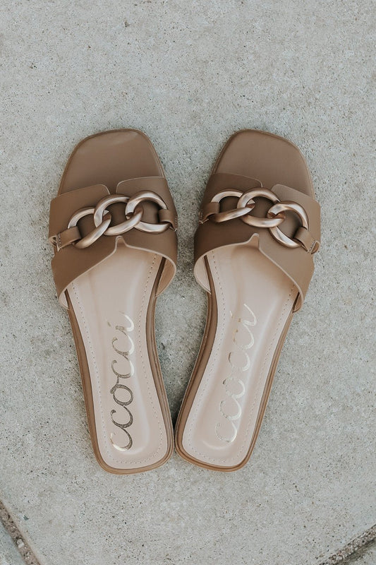 Chain Detail Taupe Slide Sandals - FINAL SALE, styled on a light stone surface.