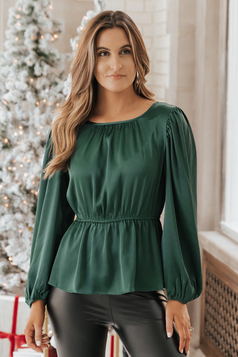 Green blouse with black skirt and knee high boots